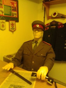 A Communist official reading a Communist paper