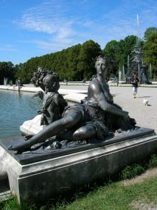 A statue adorning a fountain in the garden